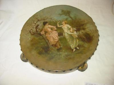 Appraisal: A TAMBOURINE painted by E Hollyer and depicting two young