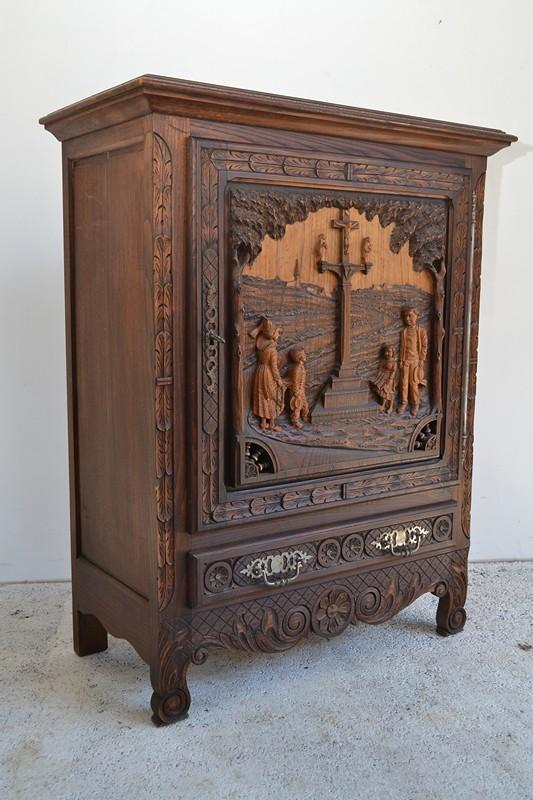 Appraisal: A GOTHIC STYLE CARVED OAK CUPBOARD WITH RELIGIOUS SCENE A