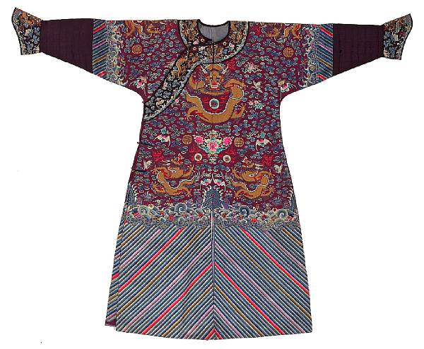 Appraisal: An aubergine ground embroidered silk dragon robe Late Qing Dynasty