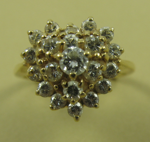 Appraisal: DIAMONDS AND FOURTEEN KARAT GOLD CLUSTER RING with round-cut diamonds