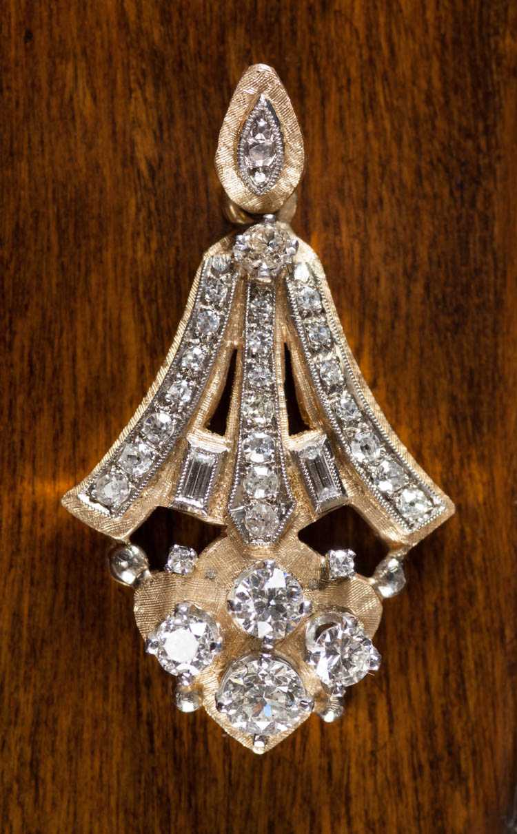 Appraisal: DIAMOND AND FOURTEEN KARAT GOLD PENDANT circa 's The yellow