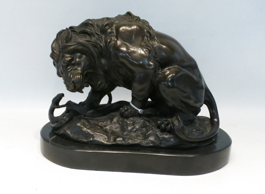 Appraisal: AFTER ANTOINE LOUIS BAYRE BRONZE LION AND SERPENT SCULPTURE French