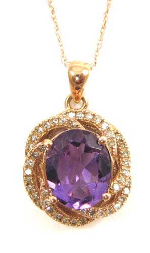 Appraisal: AMETHYST AND DIAMOND PENDANT NECKLACE the pendant suspended on an