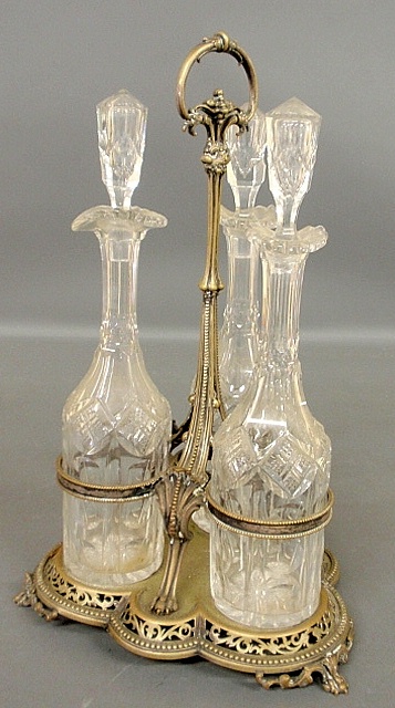 Appraisal: - Victorian cut crystal three-piece decanter set mounted in an