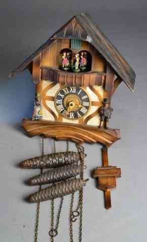 Appraisal: GERMAN CUCKOO CLOCKDecorative clock with folk costumed German figures Including