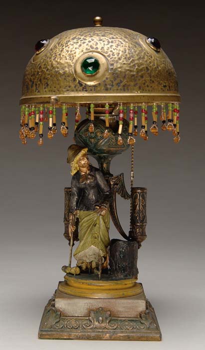 Appraisal: FIGURAL CROQUET LAMP WITH JEWELED SHADE Polychrome decorated lamp has