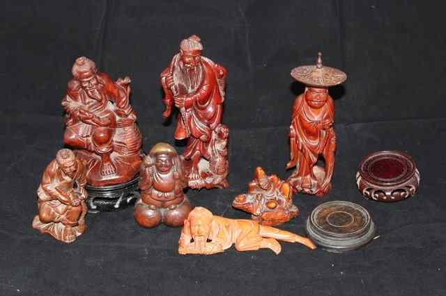 Appraisal: A QUANTITY OF ORIENTAL HARDWOOD CARVINGS of fishermen a man