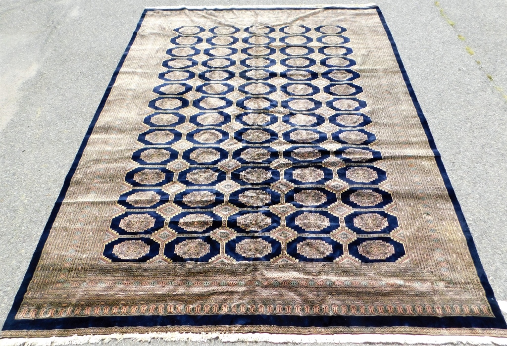 Appraisal: LG NAVY TAN GEOMETRIC RUG Middle East th CenturyTan pale