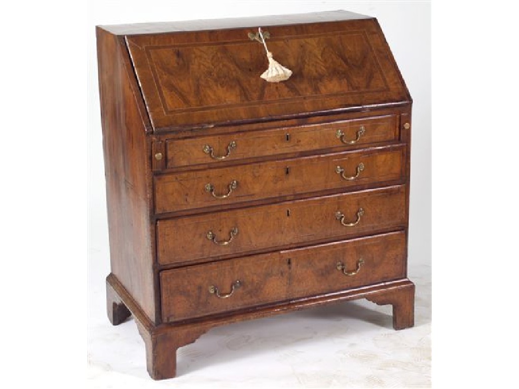 Appraisal: GEORGE II WALNUT SLANT-FRONT BUREAU the cross-banded string-inlaid slope opening