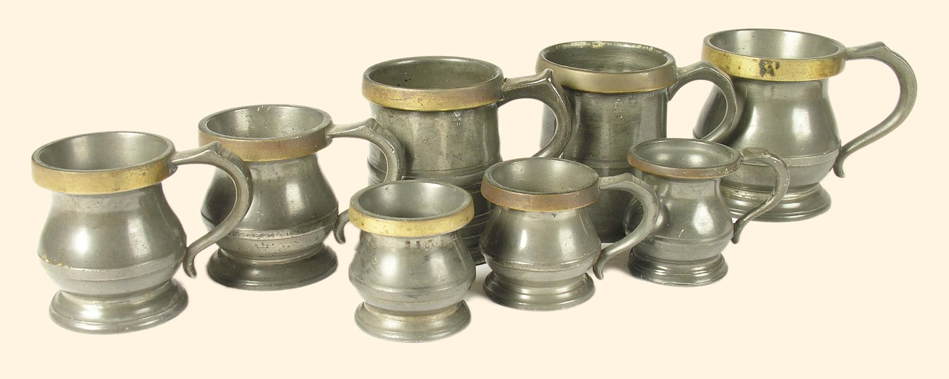 Appraisal: Eight pewter measures with brass rims four by W R