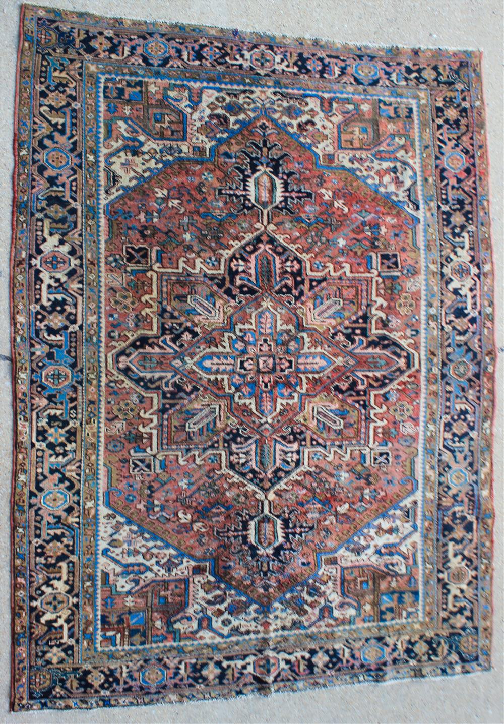 Appraisal: HERIZ RUG with rose blue taupe navy on cream field