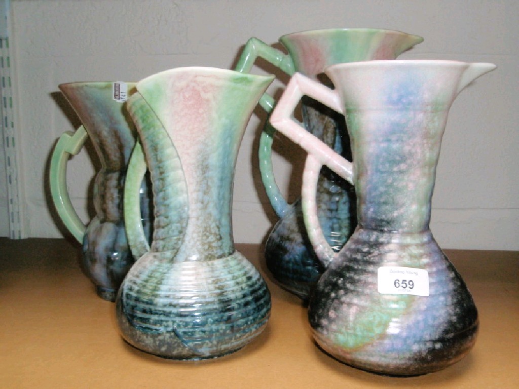 Appraisal: Four various jugs in similar pink green and grey colouration