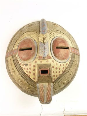 Appraisal: An African mask with polychrome decoration and applied embossed metal