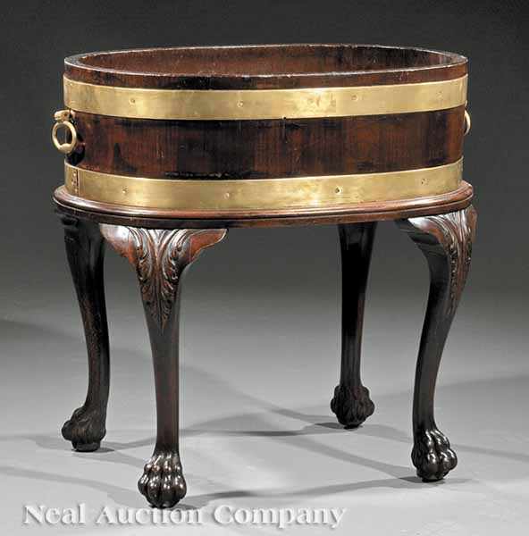 Appraisal: A Georgian-Style Brass-Bound Mahogany Wine Cooler oval body with banding