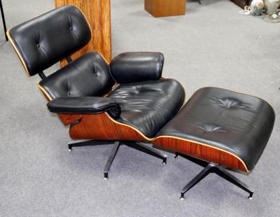 Appraisal: After Charles Ray Eames a modern reclining chair and footstool