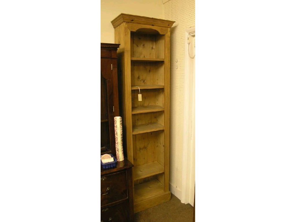 Appraisal: A tall narrow waxed pine open bookcase six adjustable shelves