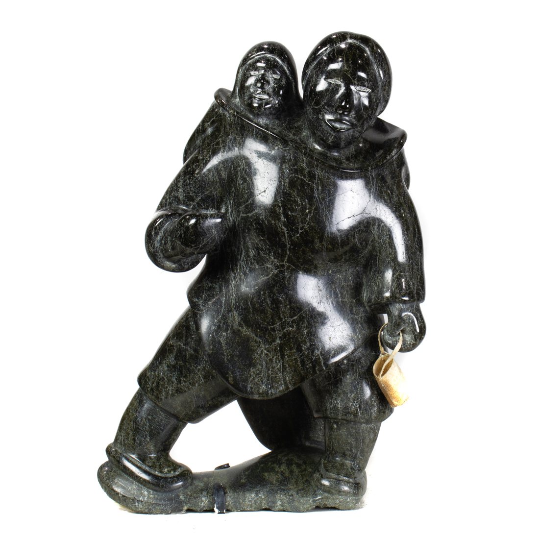 Appraisal: AN INUIT SERPENTINE FIGURE OF A MOTHER AND CHILD WITH