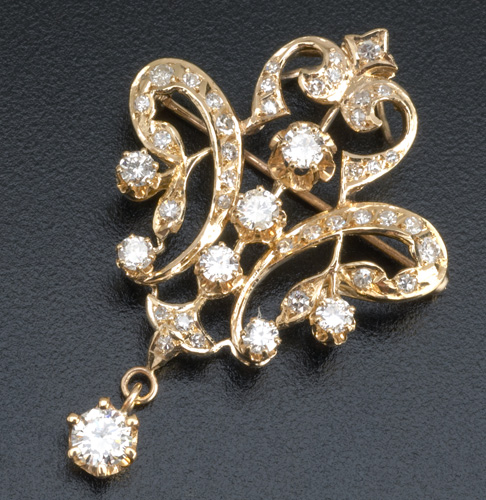 Appraisal: Shield-form diamond brooch in k yg th C Three prong-set