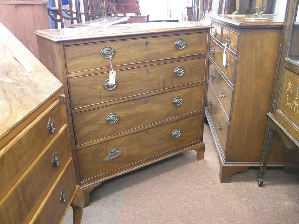 Appraisal: A George III mahogany chest four long cock-beaded drawers each