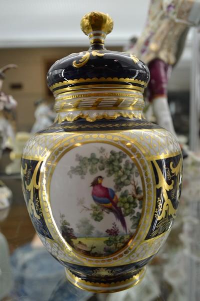 Appraisal: A PAIR OF ROYAL CROWN DERBY PORCELAIN LIDDED VASES PAINTED