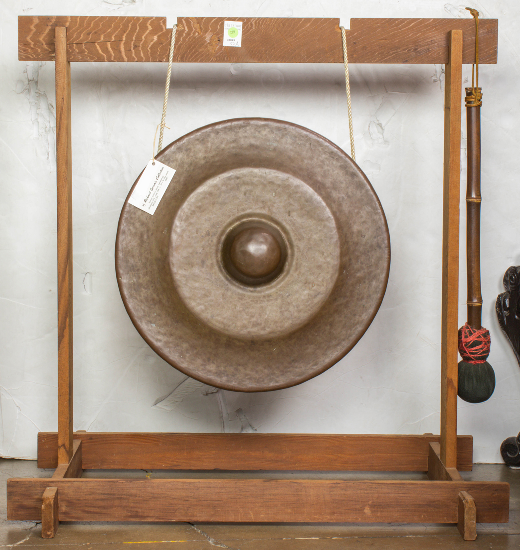 Appraisal: SOUTHEAST ASIAN BRONZE GONG AND STAND Southeast Asian bronze gong