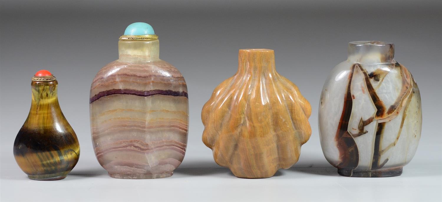 Appraisal: Banded mottled hardstone Chinese snuff bottles lacking stoppers tallest