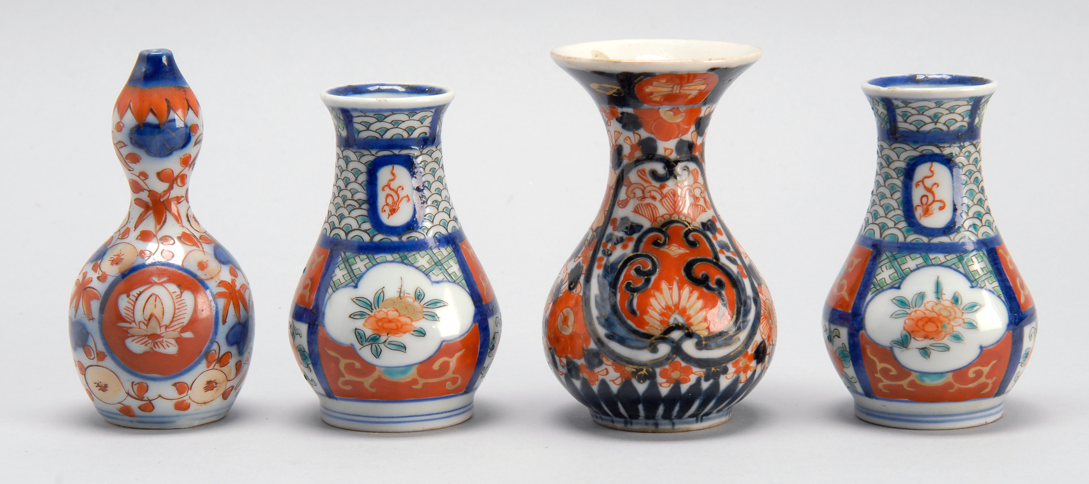 Appraisal: FOUR IMARI PORCELAIN MINIATURE VASES th CenturyThree in pear shape