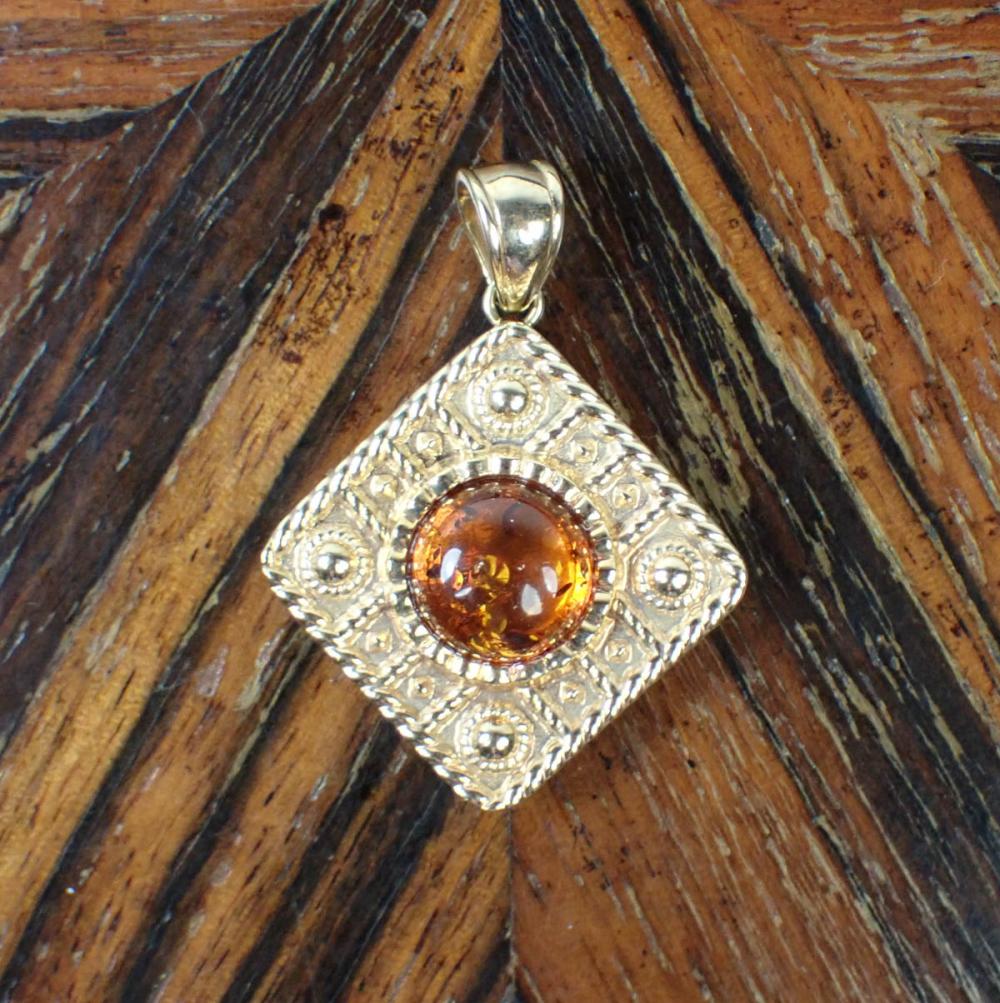 Appraisal: MILOR ITALY AMBER AND FOURTEEN KARAT GOLD PENDANT The Italian