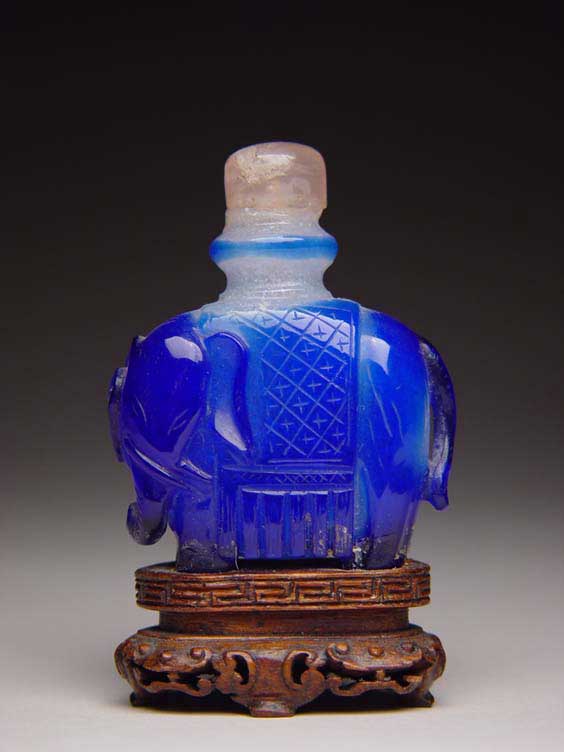 Appraisal: ANTIQUE OVERLAY GLASS SNUFF BOTTLE Rare and antique carved overlay