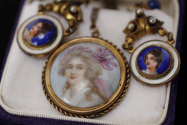 Appraisal: European hand painted miniature portrait pendant on porcelain and a