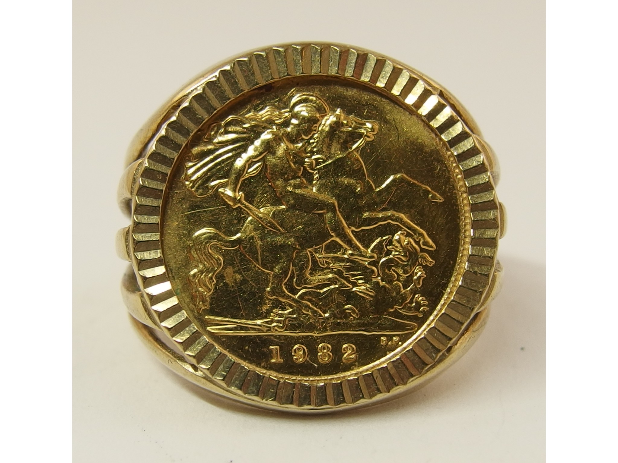 Appraisal: A gold half sovereign in a ct ring mount