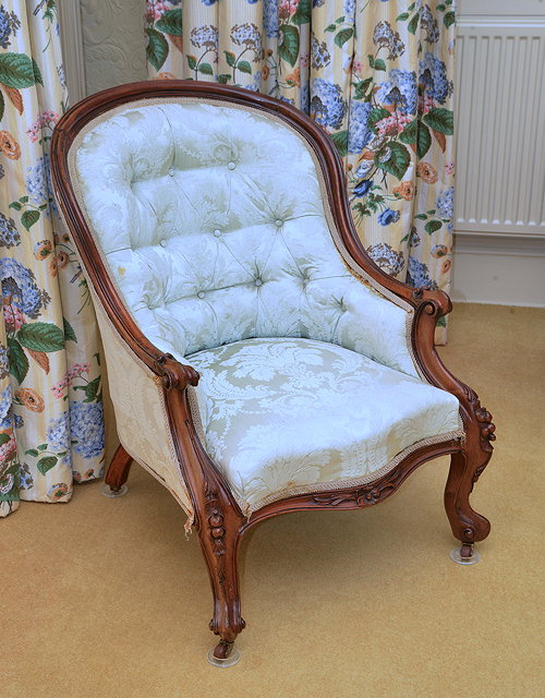 Appraisal: A TH CENTURY ROSEWOOD FRAMED TUB ARMCHAIR with curving back