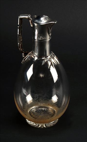 Appraisal: A Victorian silver mounted glass claret jug by E H