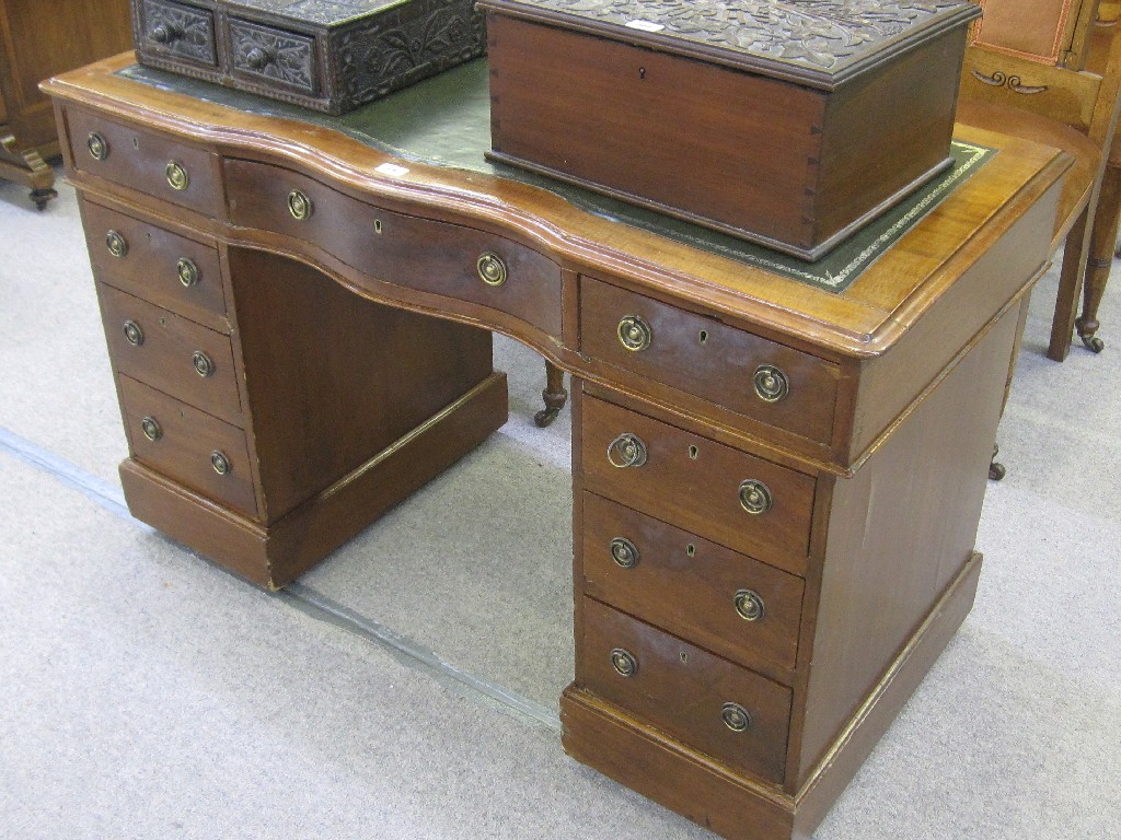 Appraisal: Mahogany serpentine front twin pedestal writing desk