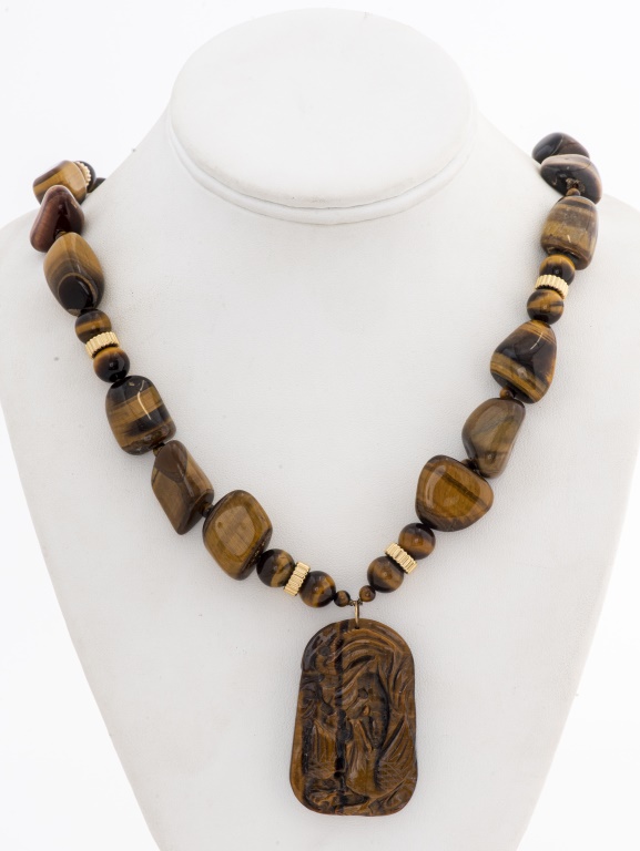 Appraisal: CARVED TIGER'S EYE K GOLD CLASP NECKLACE Chinese tiger's eye