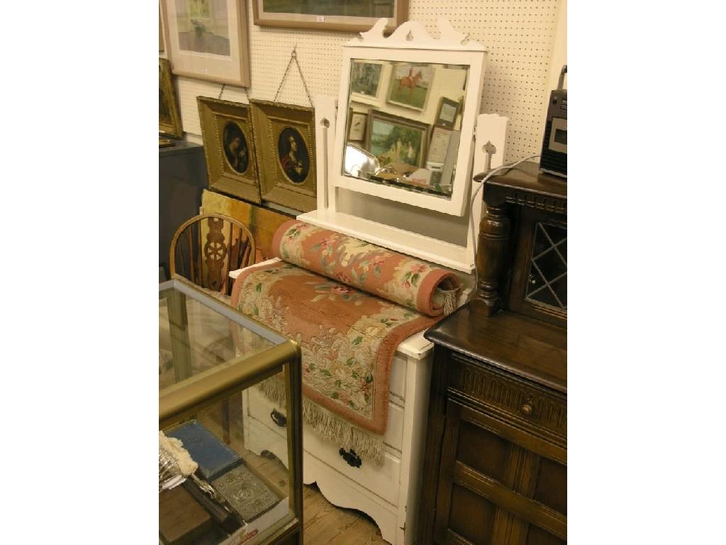 Appraisal: A white-painted oak dressing chest adjustable mirror above three long