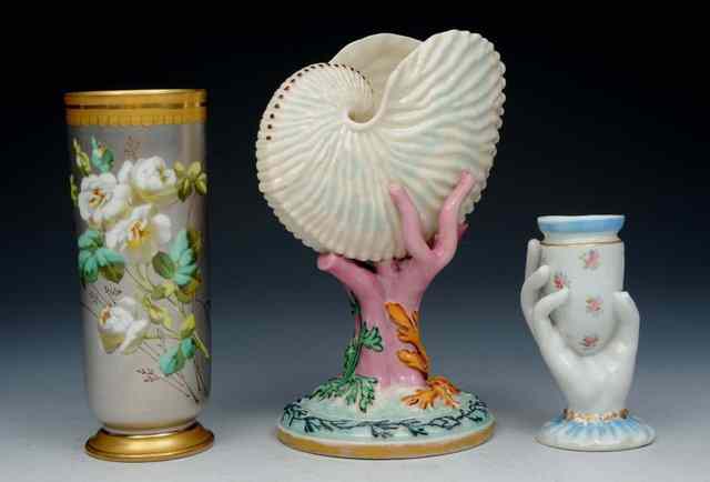 Appraisal: A ROYAL WORCESTER IRIDESCENT NAUTILUS SHELL VASE with seaweed decoration