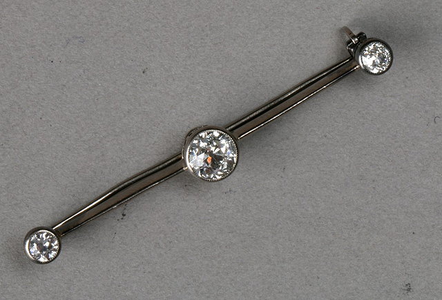 Appraisal: A THREE STONE DIAMOND SET BAR BROOCH central old cut