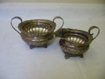 Appraisal: A SUGAR AND CREAM SET of shallow circular fluted form