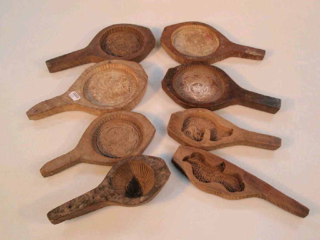 Appraisal: A collection of eight old wooden or butter confectionery pats