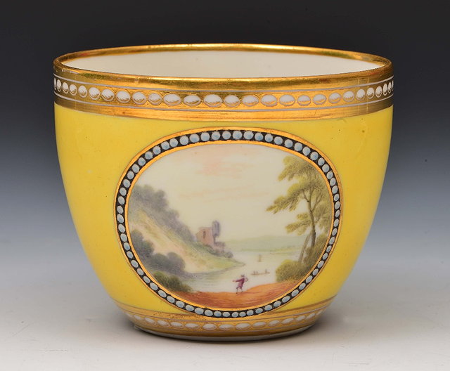 Appraisal: Derby yellow ground tea cupcirca with puce crown crossed baton