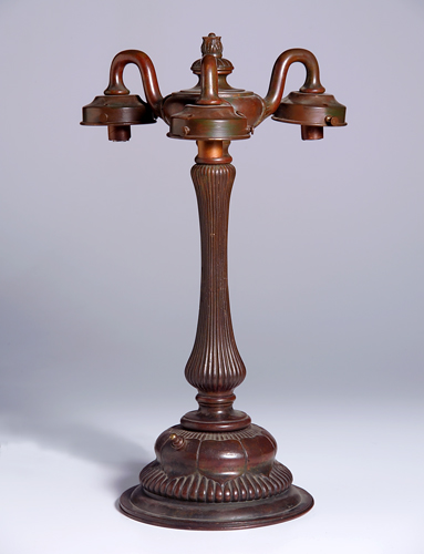 Appraisal: TIFFANY STUDIOS Bronze fluted three-socket table lamp base surrounded with