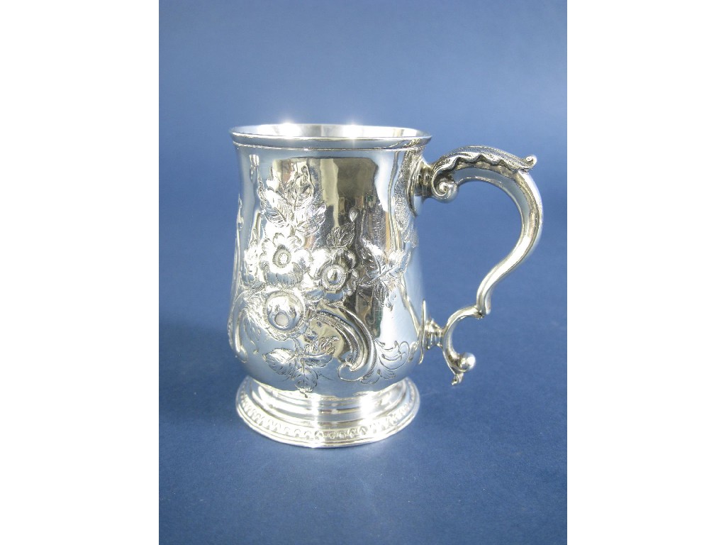 Appraisal: A George III baluster Mug with later floral embossing vacant