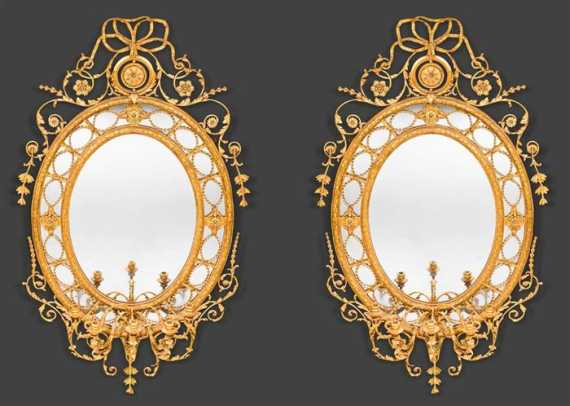 Appraisal: PAIR OF LARGE OVAL MIRROR APPLIQUES George III style England