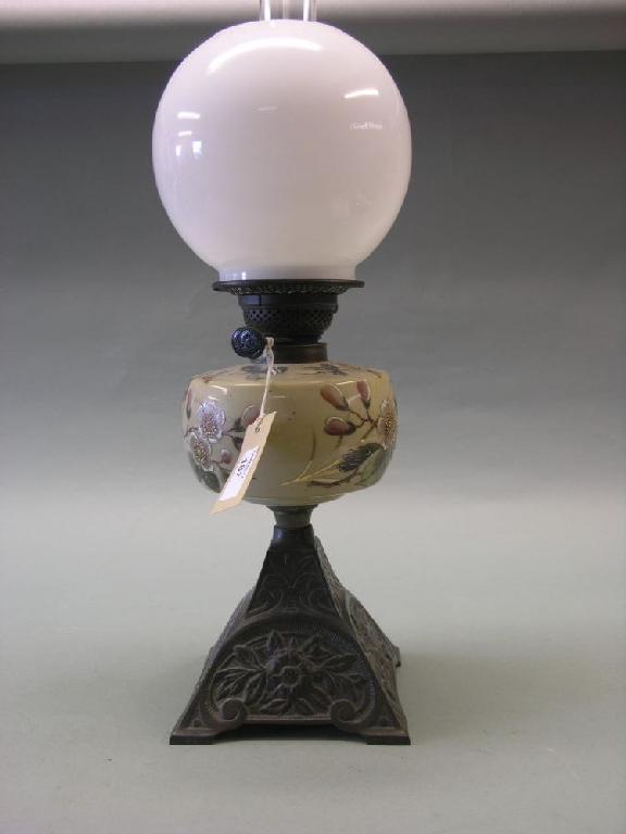 Appraisal: A Victorian oil lamp complete with floral painted opaque glass