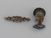 Appraisal: A silver enamel and marcasite brooch modelled as a tribal