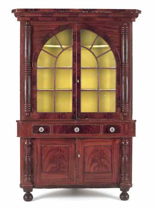 Appraisal: Pennsylvania painted two-part corner cupboard ca retaining its original vibrant