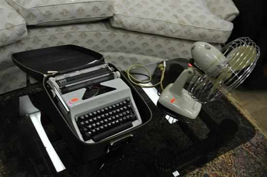 Appraisal: AN OLYMPIA TYPEWRITER IN CASE AND A s ELECTRIC FAN