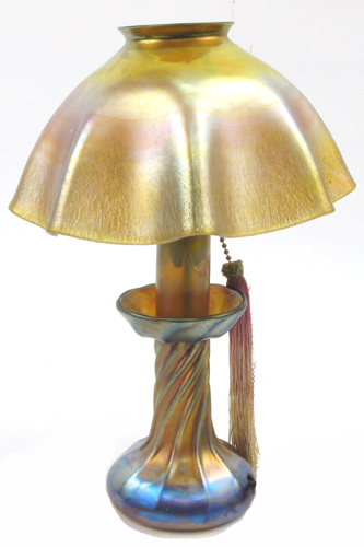 Appraisal: A TIFFANY IRIDESCENT ART GLASS CANDLE LAMP electrified having a