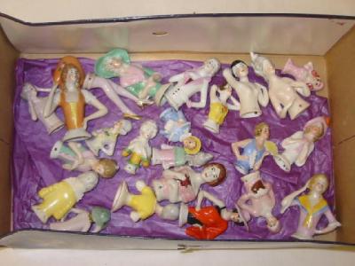 Appraisal: Twenty two porcelain pin cushion dolls and a pair of